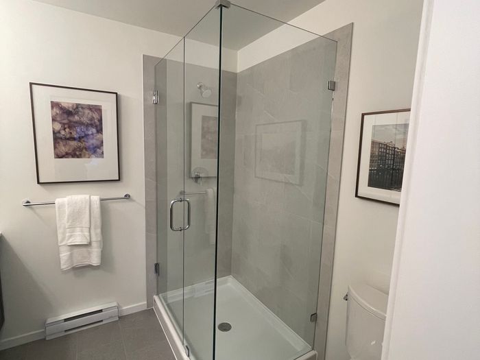 Frameless glass shower enclosure, Vancouver condo