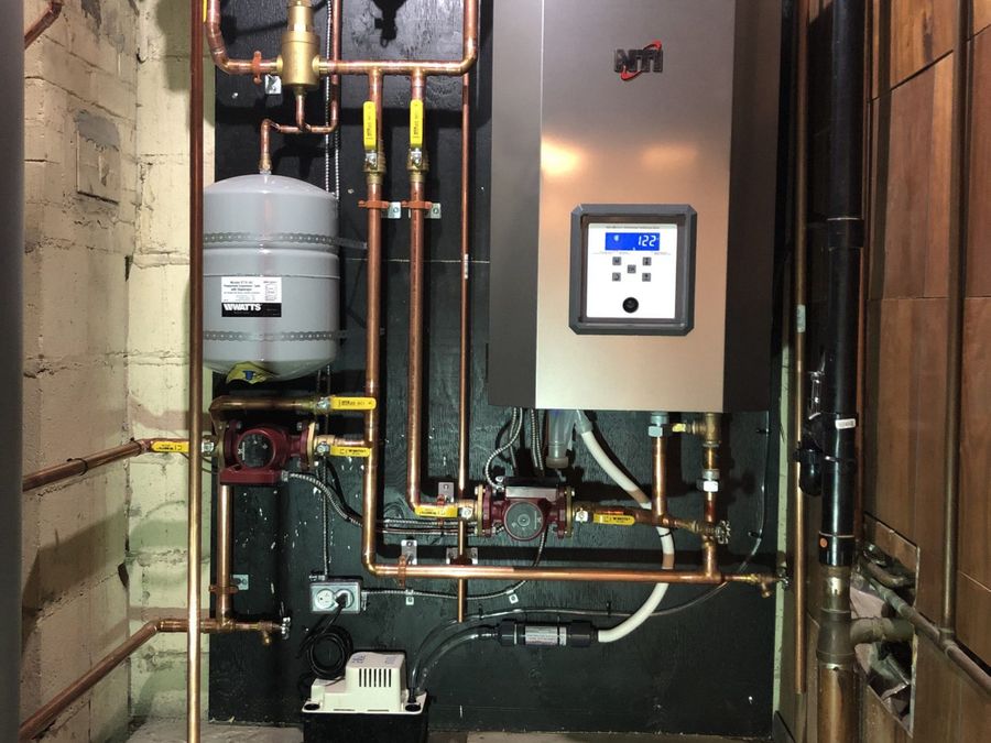 NTI high-efficiency boiler with copper piping and expansion tank, installed by ARSuperfix