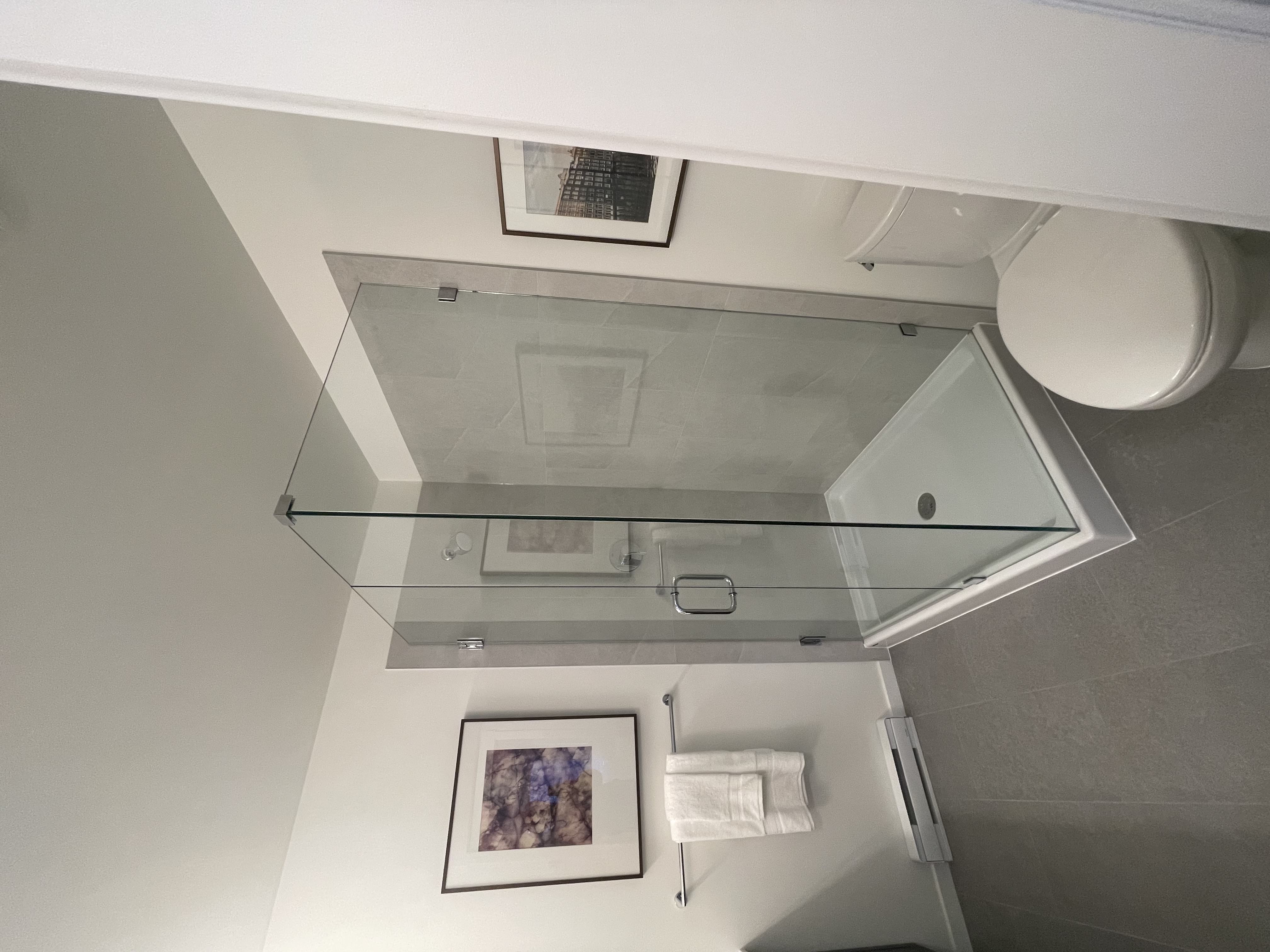 Frameless glass shower enclosure, Vancouver condo