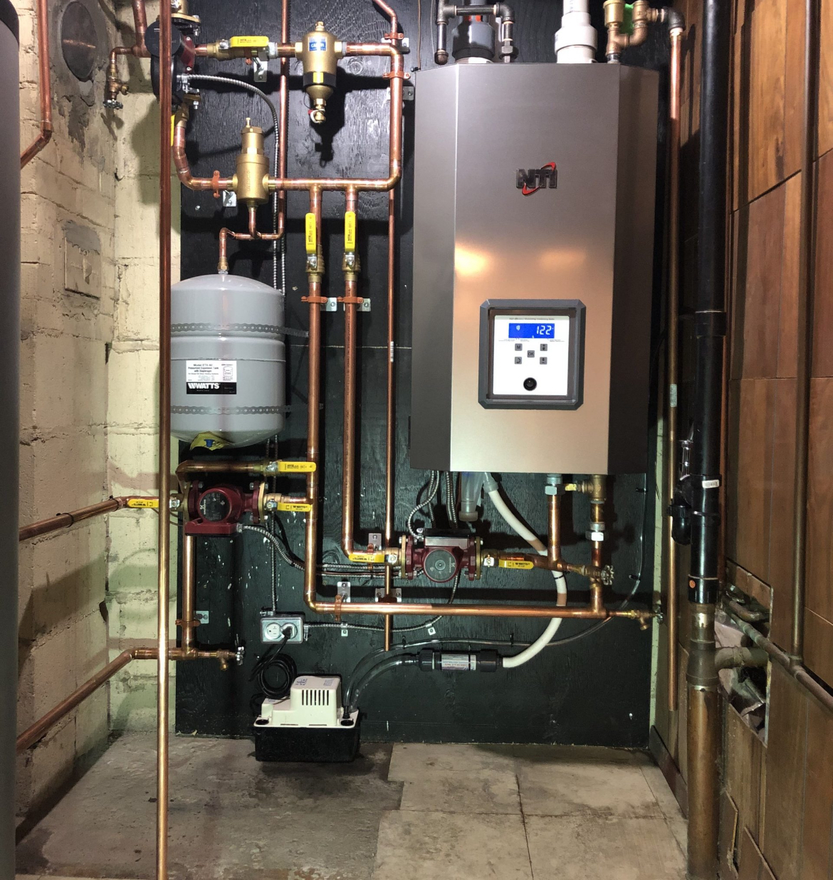 NTI high-efficiency boiler with copper piping and expansion tank, installed by ARSuperfix